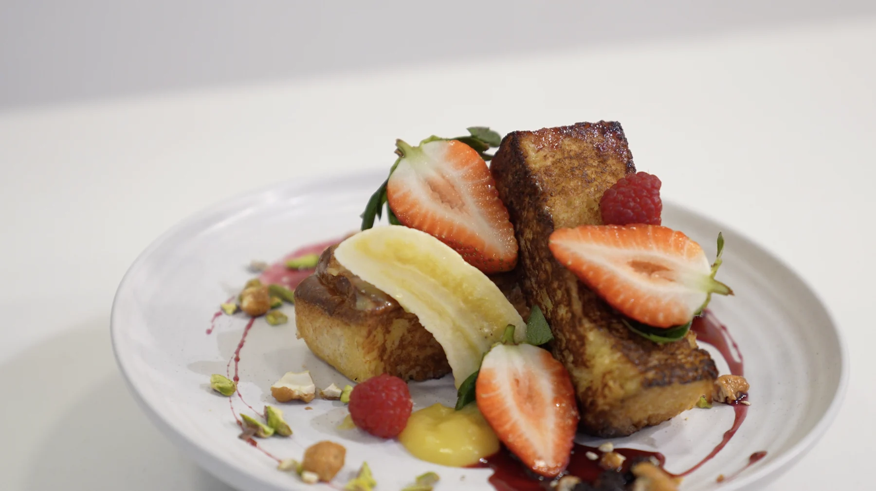 French toast with strawberries, banana, raspberries and lemon curd
